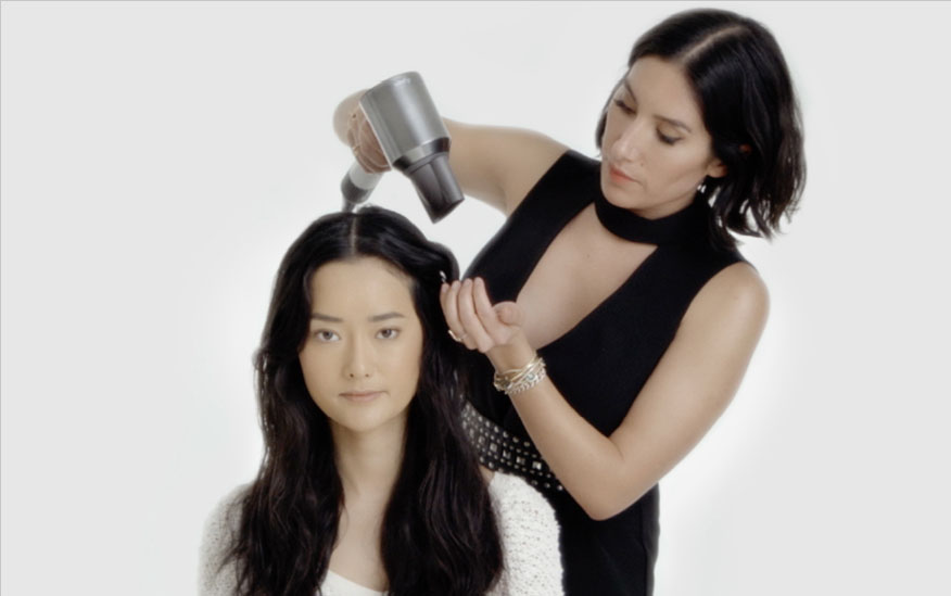 Stylist using the Dyson Supersonic hair dryer Professional